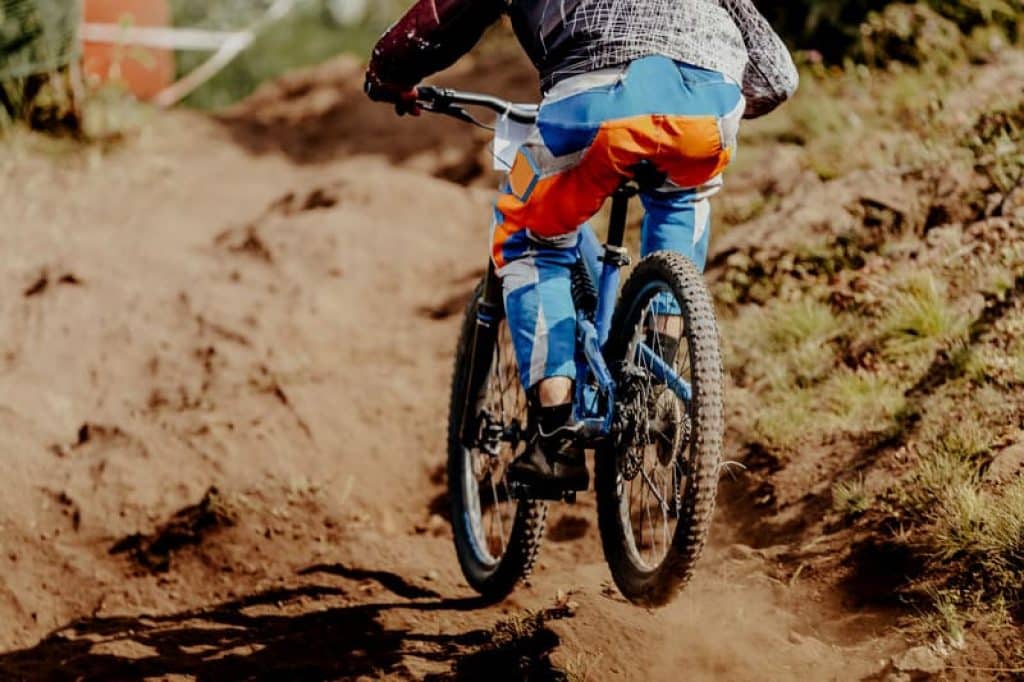 extreme downhill rider with his bike