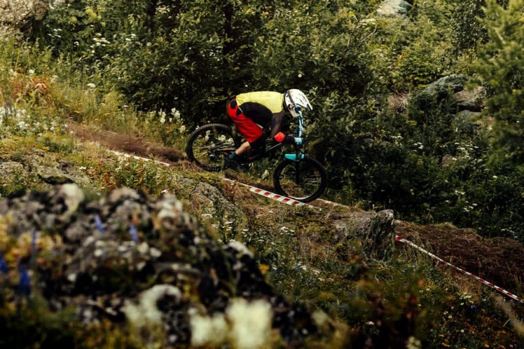 rider biking downhill on the trail